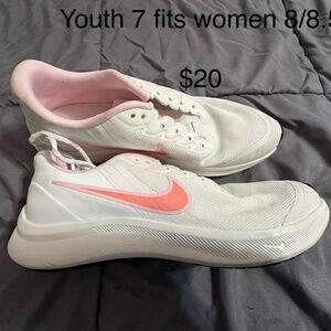 Nike white with pink swoosh youth women’s